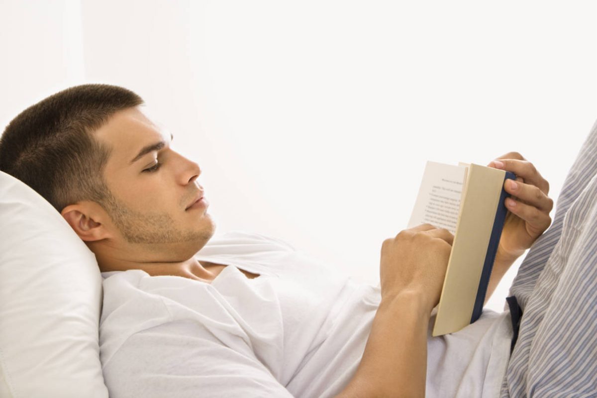 04-man-reading-book-in-bed-1200x800