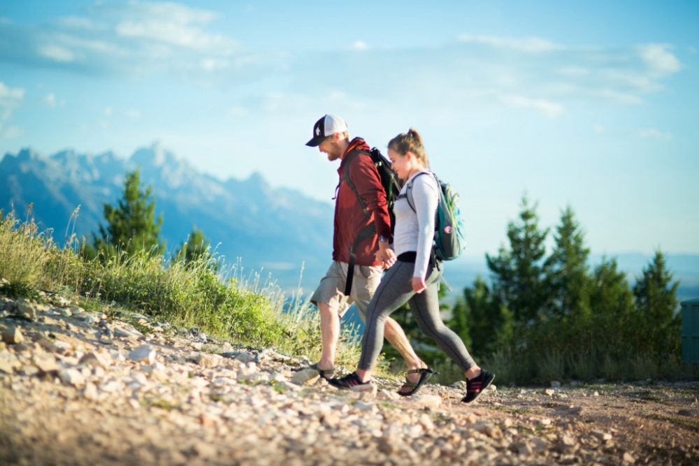 couple-hiking-atop-snow-king-mountain-1024x683-1000x667